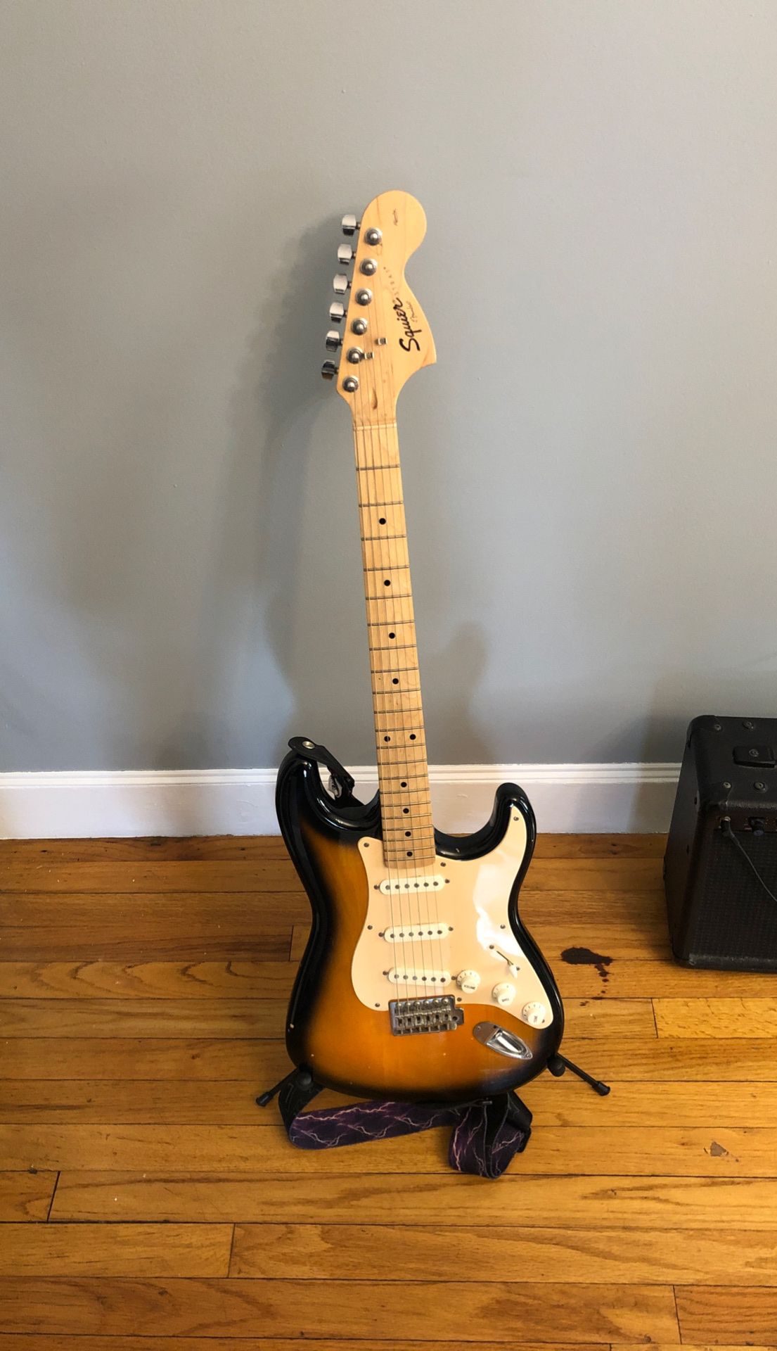 Fender squire strat electric guitar with amplifier