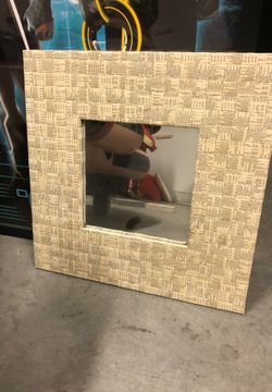 Mirror with newspaper weave design