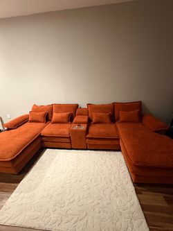 Orange U shaped couch
