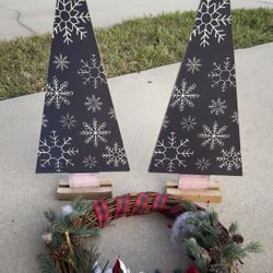 Selling 2 wooden trees with garland.