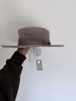 Three people knew with tags hat, one-size-fits-all