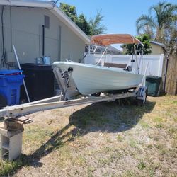 64’ Starcraft Boat WITH 20 Hp Motor & 14 Inch Aluminum Trailer 