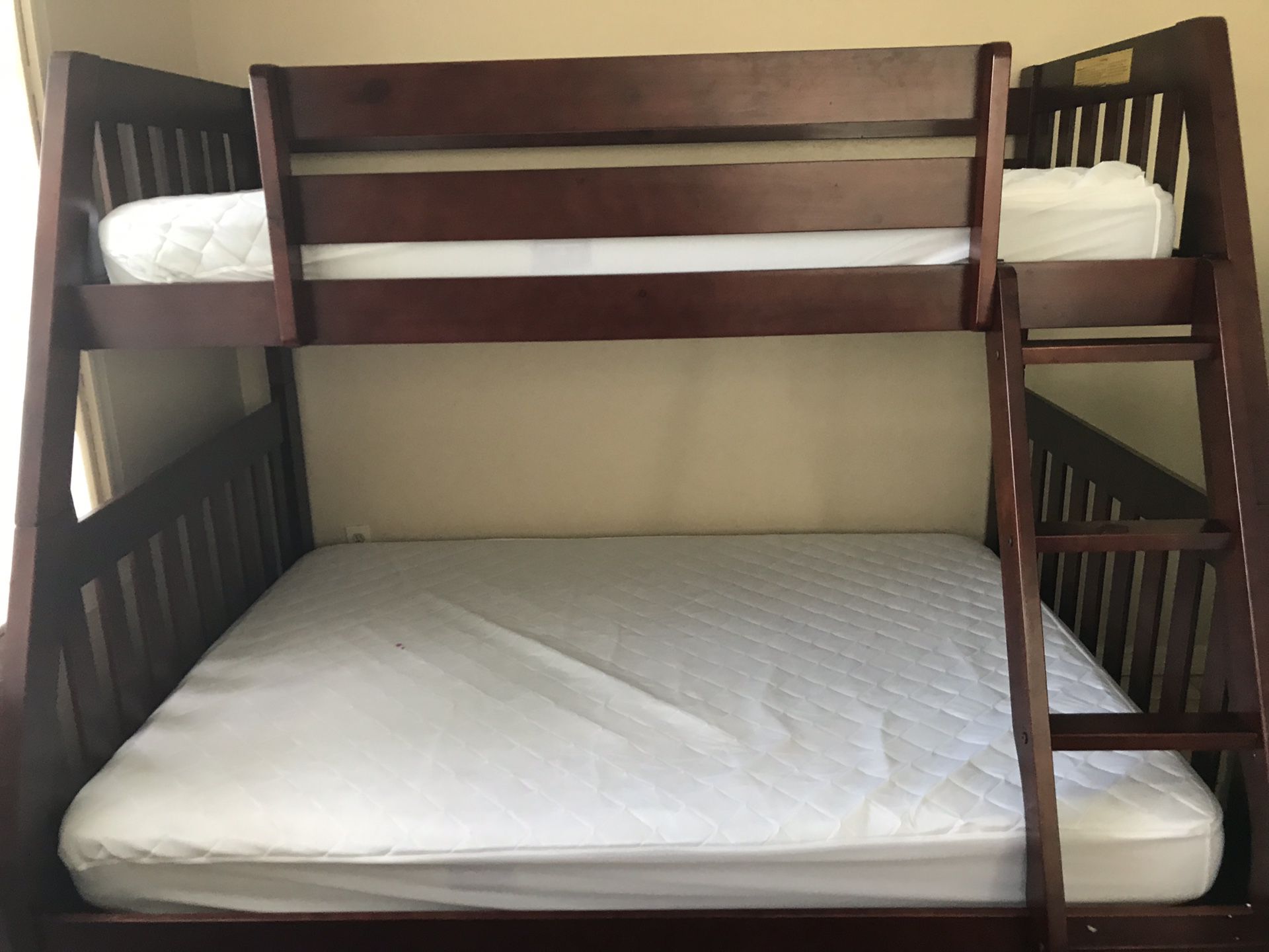 Solid wood bunk bed with mattress protectors and 2 sets of sheets - double on bottom and twin on top! $450