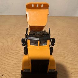 Small yellow dirt truck