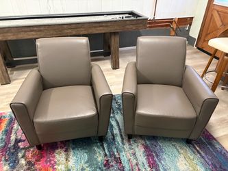 2 Faux leather arm chairs
