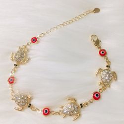 Bracelet  Turtles gold plated with red stones and zirconias 