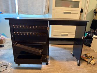 Folding sewing table