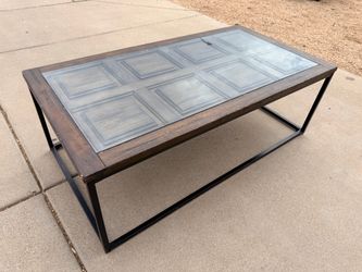Brown Wood Coffee Table with Glass Top (LxWxH: 26.5” x 50” x 17”)