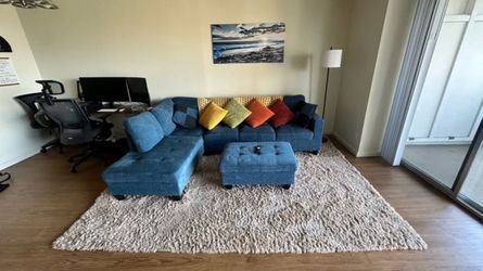 Modern Blue L-Shaped Sofa with Chaise + Ottoman + Large Rug + Vibrant Throw Pillows Bundle!