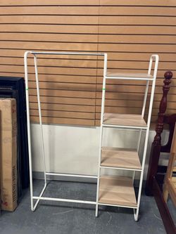 Clothing rack and shelf open closet (in store)