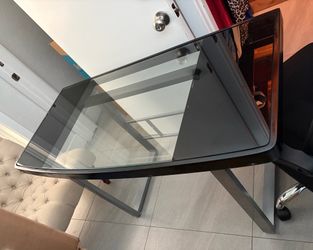 Glass/metal desk with black office chair
