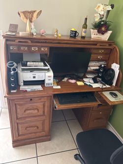Entertainment center,  office desk,  grandfather clock