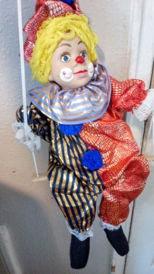 Swinging Porcelain Clowns