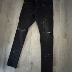 Purple jeans with white paint