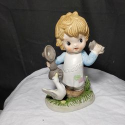 Vintage Girl With Phone And Duck Figurine By Royal Crown . Figurine is in good condition 