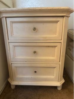 Classic white nightstand with three drawers