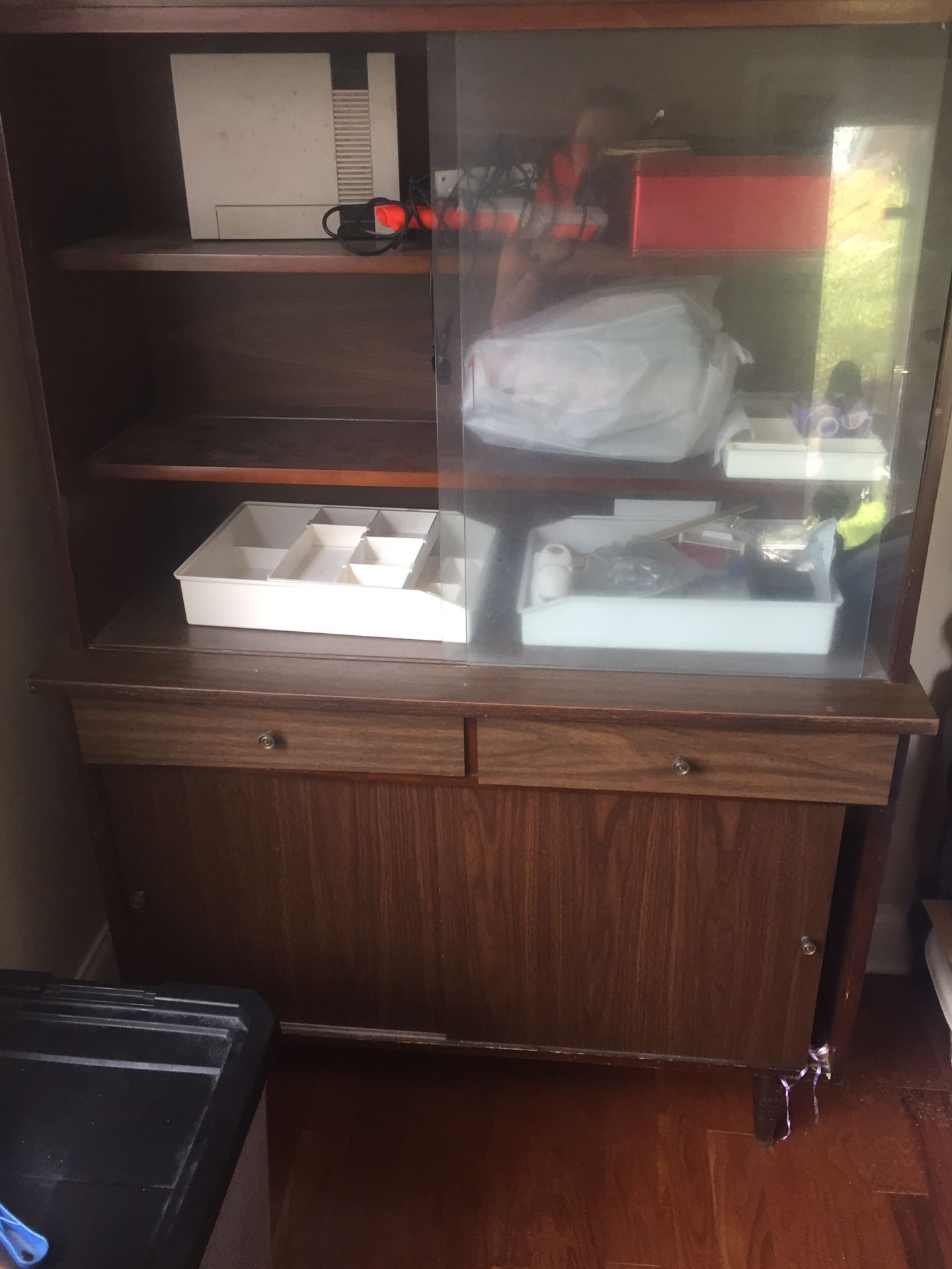 Free cabinet 2 glass sliding doors up top 2 wooden sliding doors below. Cabinet only very heavy must pick up bring help