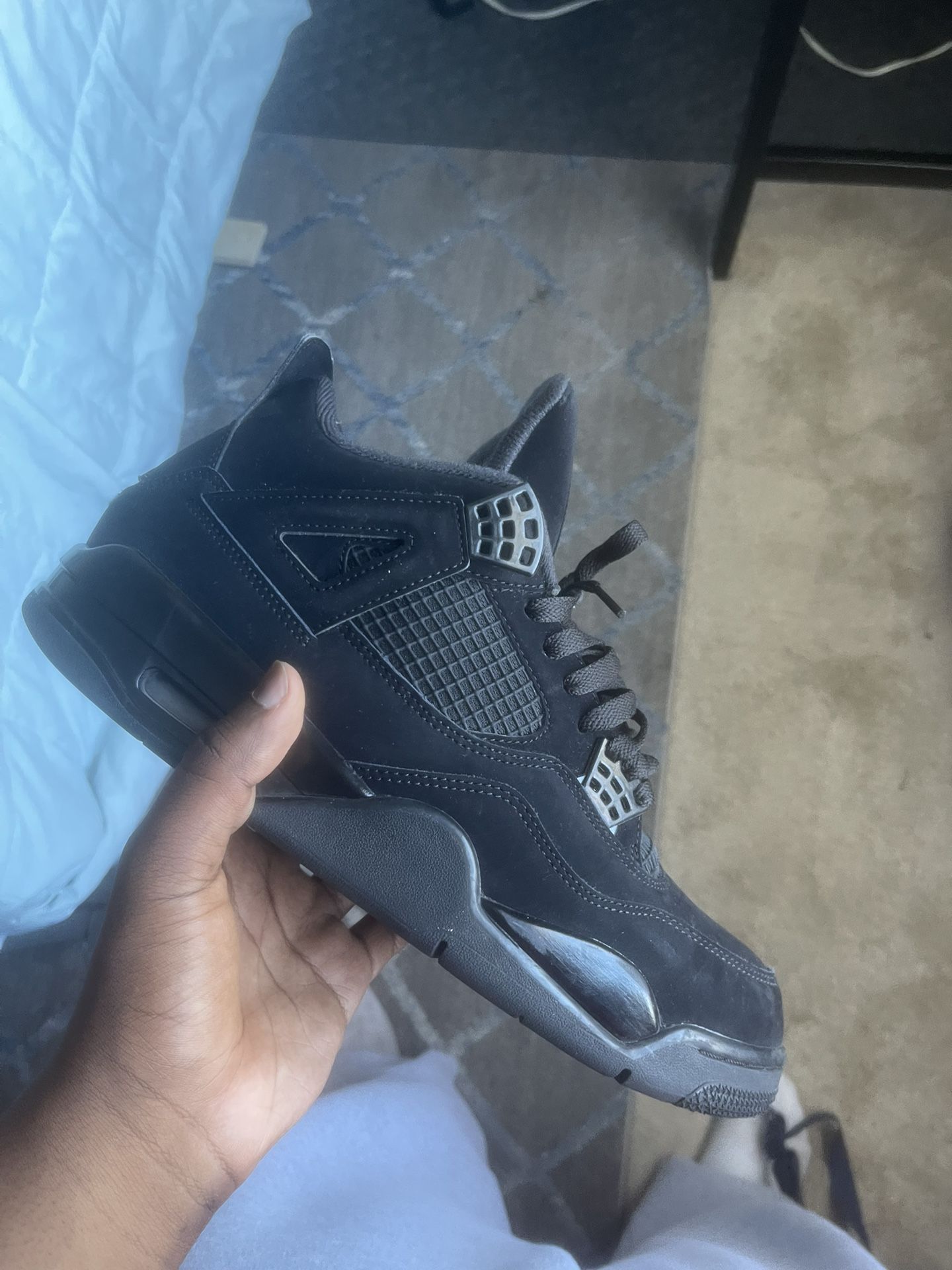 Black Cat Jordan 4’s