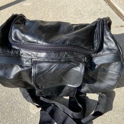 Diamond plate leather bag with front pouch and straps 