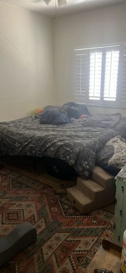 King mattress with metal frame on wheels