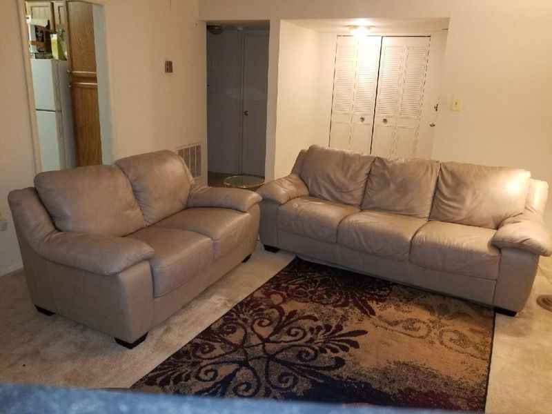 Beige patent leather padded 3-seat sofa and loveseat set excellent condition.