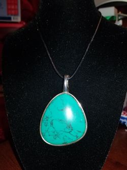 Designer Turquoise enhancer on a 18"leather cord.
