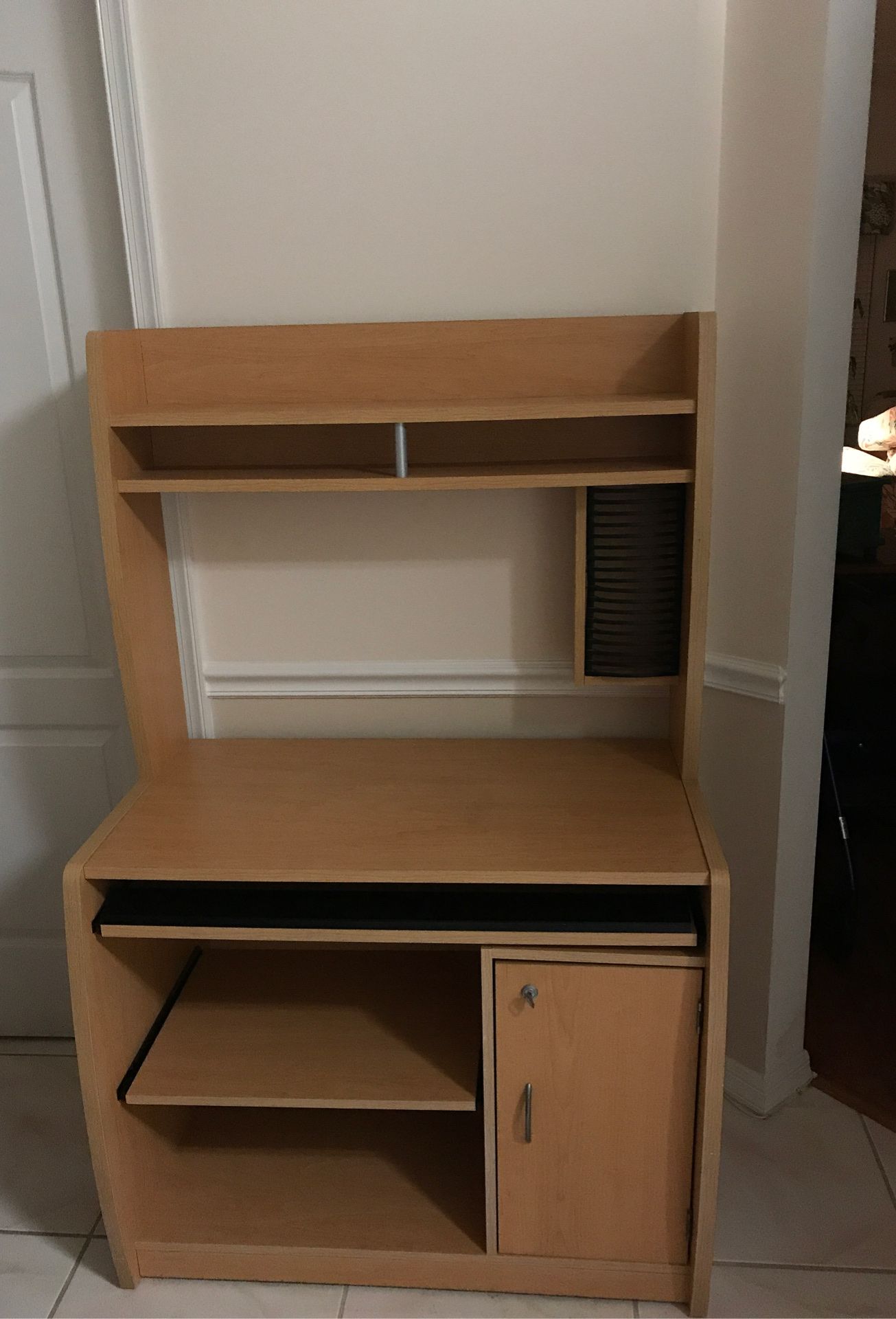 Computer cabinet with pull-out shelf for printer. Pull-out shelf for keyboard & other storage. CD & hard drive storage. On casters for easy moving.
