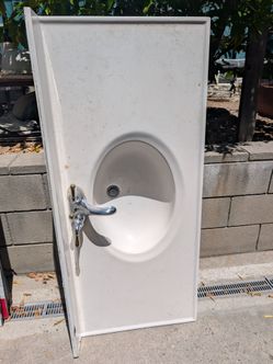 Sink and faucet in very good condition. About 48 in by 21 in the faster in good condition and the plumbing is all good