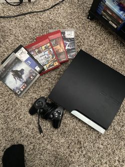 PS3 with games and controller