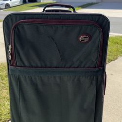 Selling large checked suitcase, 29 x 18 inches.