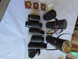 Vintage film camera lenses, filters, teleconvertor.