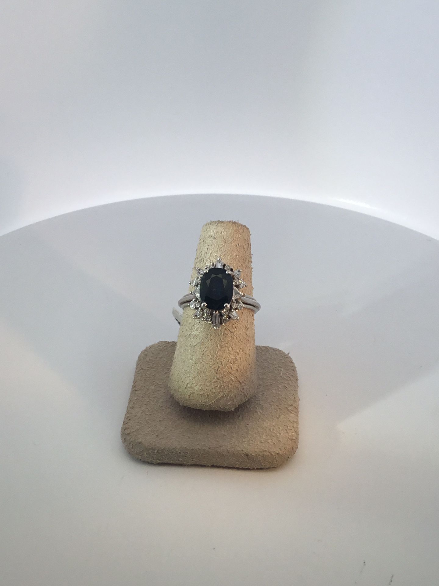 Lady’s Withe 14Karat Fashion Ring Size 5.75 With Various Shape Diamonds And A Center Estate Sapphire From Austria