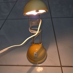 Vintage telescopic halogen desk lamp, collapsed height 12", fully extended height 21", base diameter 4", max 300 watts, 120V, fully adjustable lamp he