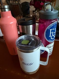 Four reusable coffee cups & water bottles