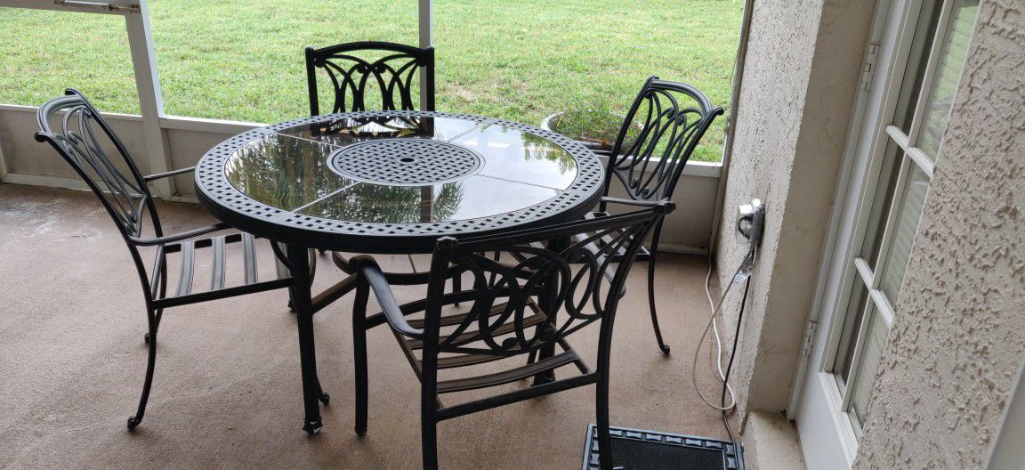 Patio Furniture With Turning Table In The middle, 4 Cushions. 49.5inch. Good Condition. $150. If You See It Here, It Is Available.