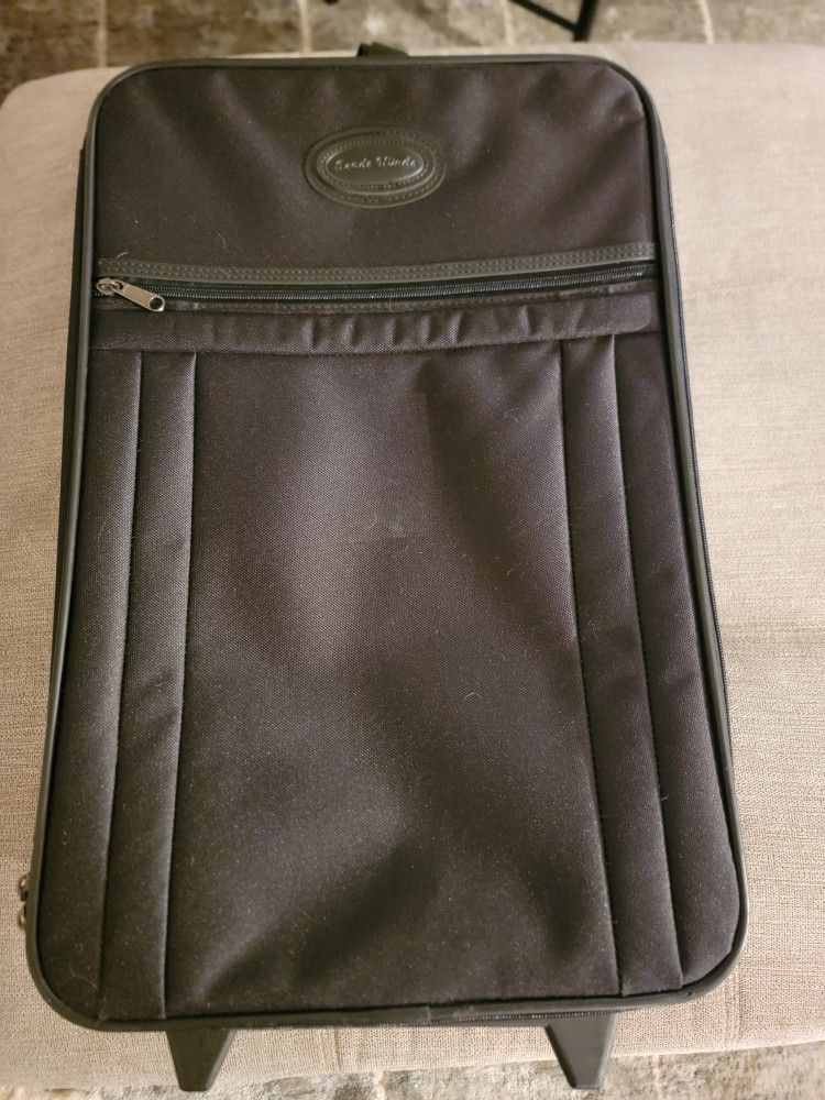 Trade Winds Rolling Suitcase. 20” Tall X 13” Wide X 7” Deep. Black