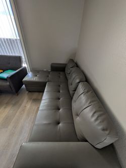 Naiomi L shaped sofa sleeper with storage.