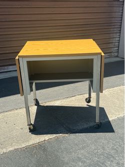 Vintage Typewriter stand with expandable sides  Metal and laminate on whe