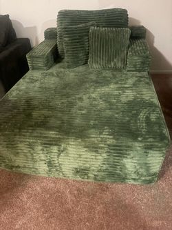 Green deep and wide couch