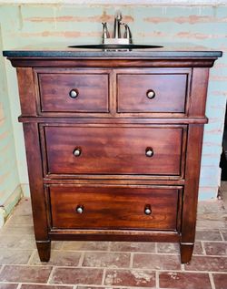 BATHROOM VANITY..VERY BEAUTIFUL HEAVY SOLID WOOD..BLACK MARBLE TOP..GOOD CONDITION
