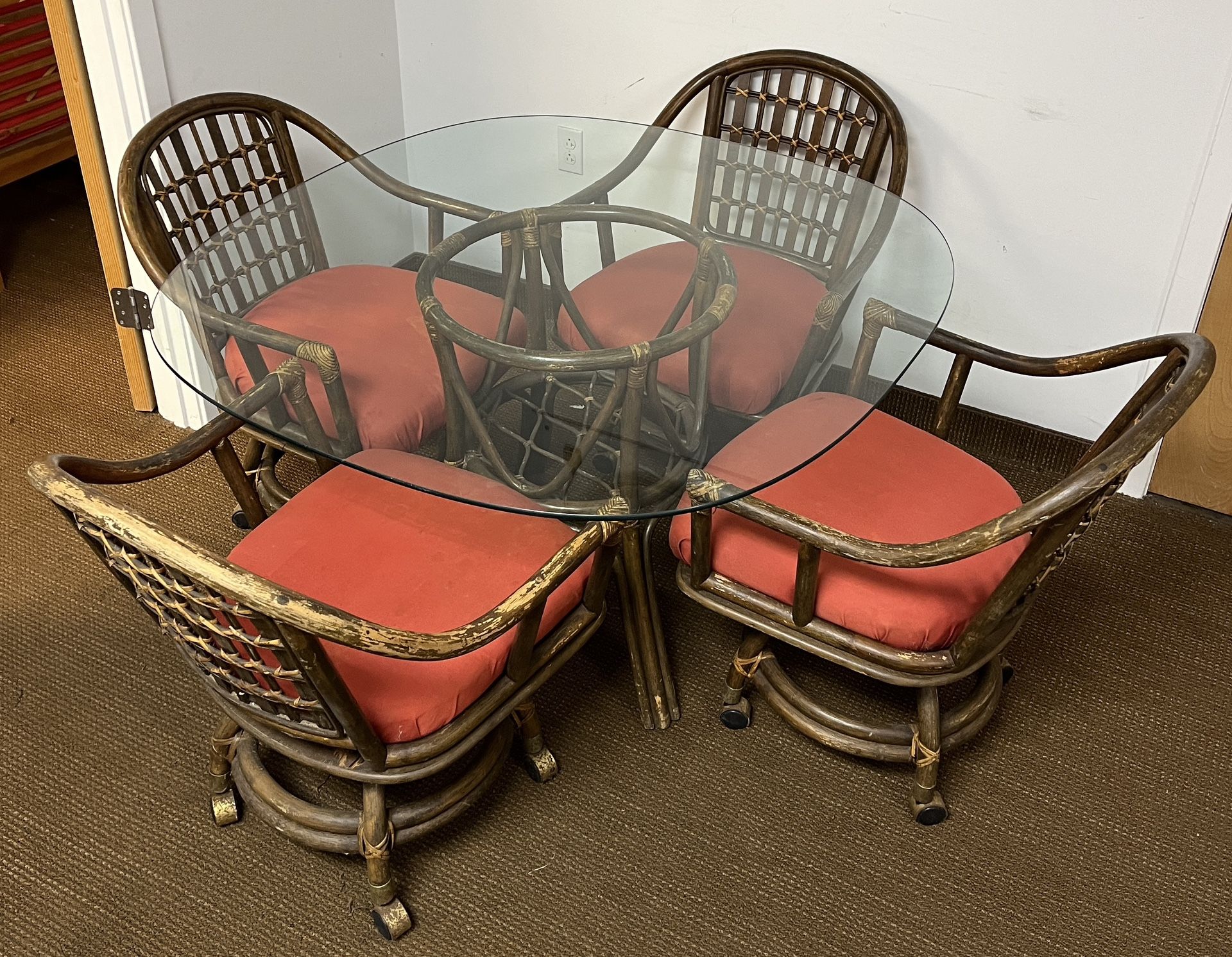 Vintage Sibley’s Bamboo Rattan Dining Table and 4 chairs on wheels. Shows age. 48” Rounded Square