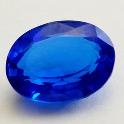 15.02 Ct Loose Clear Blue Zoisite Tanzanite-Like Excellent Oval Cut Gemstone. Dimensions are approximate. The product is a 15.02 Ct loose clear blue Z
