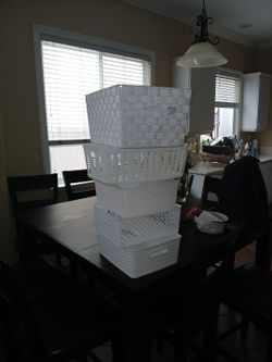 I wiccker basket and 4 plastic  bins/ baskets