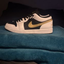 Jordan 1 Low Golden Swoosh 