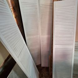 Two 32" bi fold full louvered doors