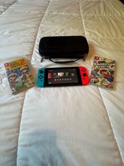 250 $$Nintendo switch with two games and  case (FREE DELIVERY)