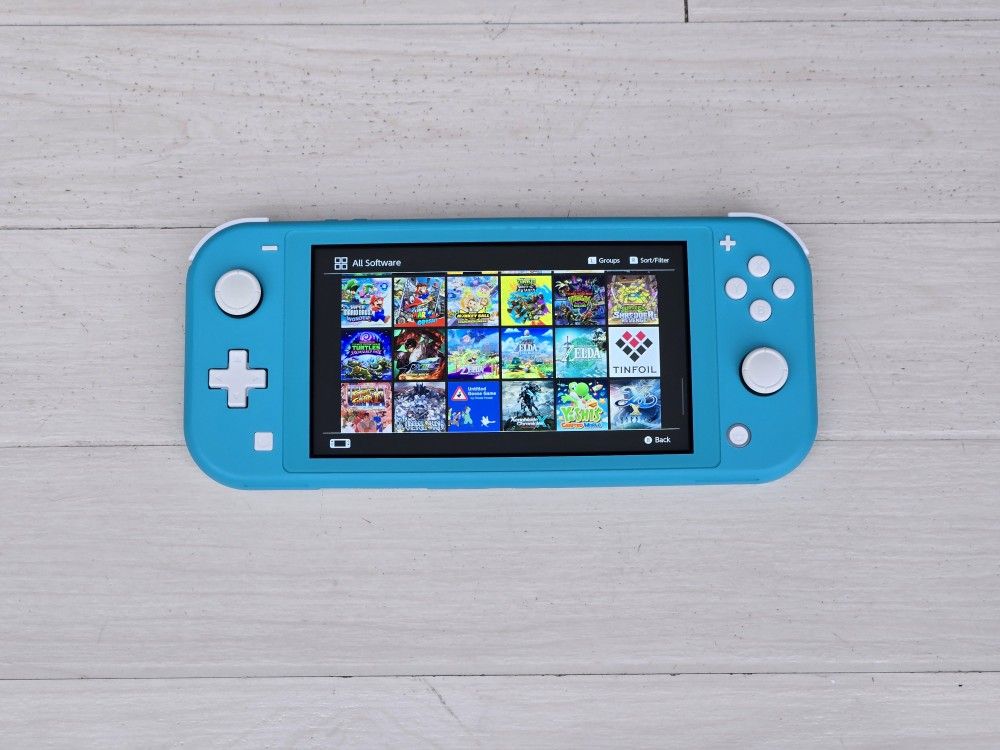 NINTENDO SWITCH LITE WITH 150 SWITCH GAMES + 10000 RETRO CLASSIC GAMES