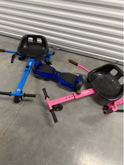 Hover board with attachable ride on cart. Extra pink cart included. Has charger and straps. Fully functional