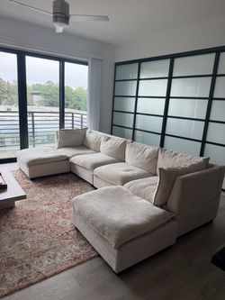 Large Beige Modular Sectional Sofa with Ottomans
