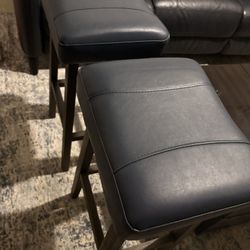 Two navy blue and leather Wood stools 